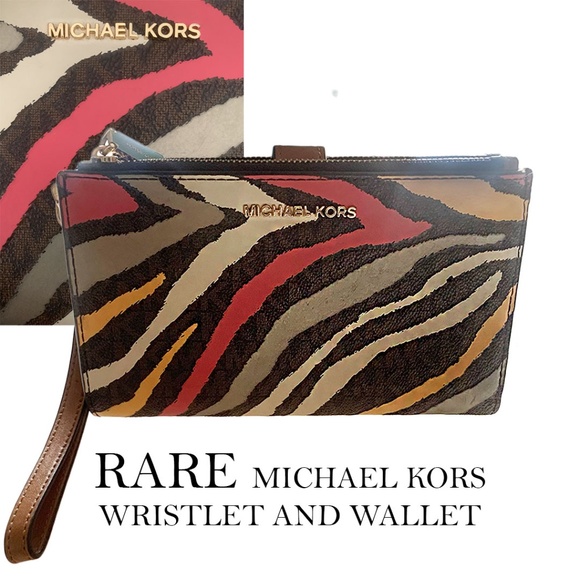 Michael Kors Handbags - NWOT Rare Michael Kors zebra wallet and wristlet